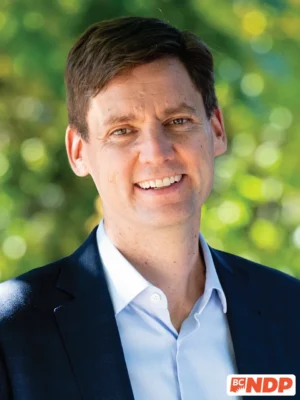 David Eby, BC NDP leader, official portrait with BC NDP logo