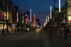 Granville Street Vancouver entertainment district at night with Orpheum and Vogue theatre signs