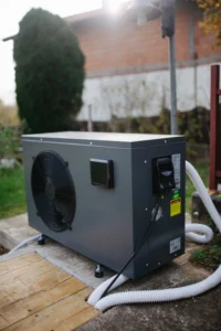 Modern heat pump unit installed outside a home on a wooden platform