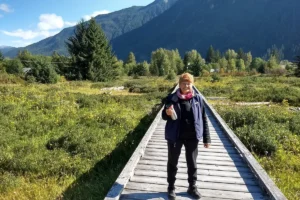 Laureen Fabian standing on a boardwalk in northern British Columbia