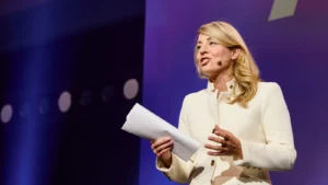 Industry Minister Mélanie Joly speaking on stage at the ALL IN 2025 conference in Montreal, in a file photo