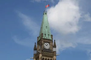 Canadian flag at half-mast above the Peace Tower clock tower in Ottawa