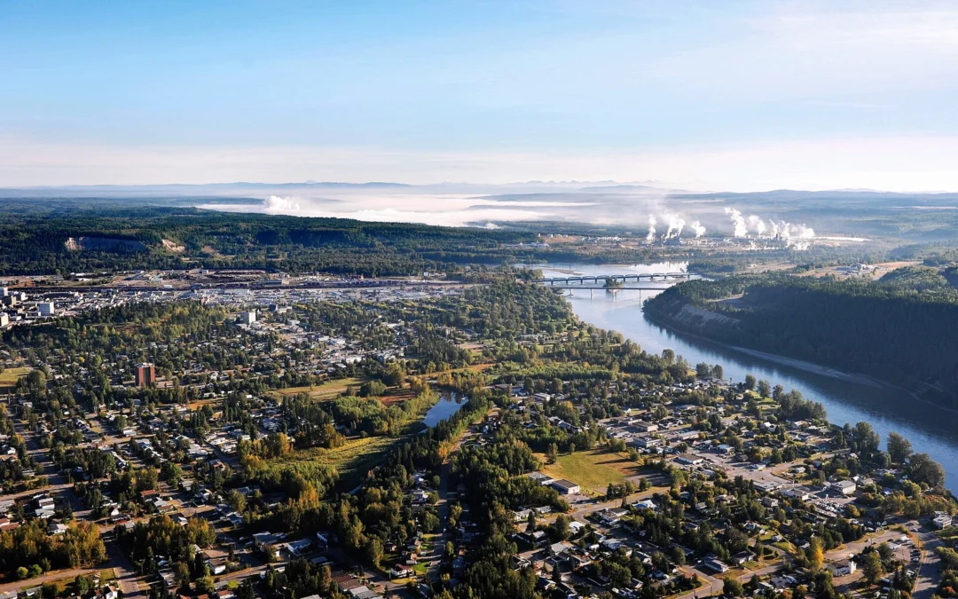 Aerial view of Prince George homes, forest and the Fraser River