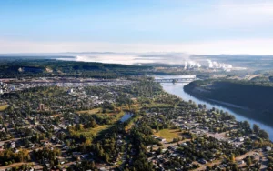 Aerial view of Prince George homes, forest and the Fraser River