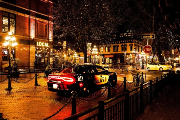 Vancouver Police Dodge Charger parked on a brick street at night